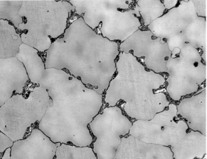 PHOTOGRAPH B – CARBIDES AT GRAIN BOUNDARIES - NOT ACCEPTABLE